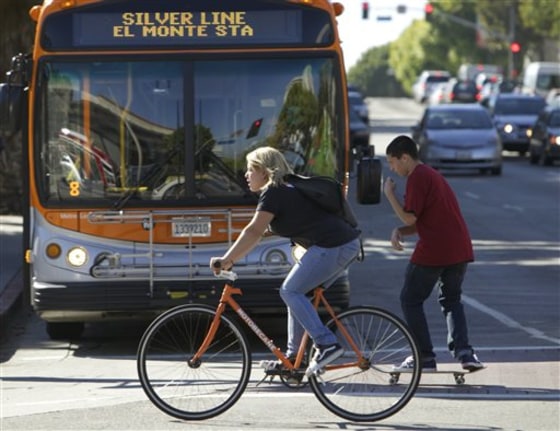 A commuter rides the streets of Los Angeles. Mayor Antonio Villaraigosa wrote an online commentary on the Huffington Post acknowledging that most of the city was designed for automobiles and it was time to recognize bicycles also belong on L.A.'s streets.